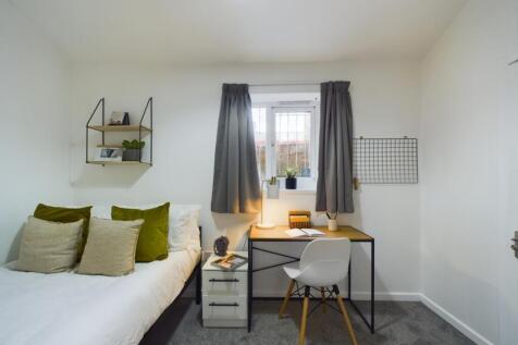 A stylish and inviting double bedroom featuring...