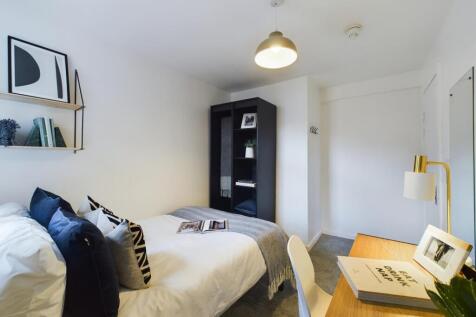 A stylish and inviting double bedroom featuring...