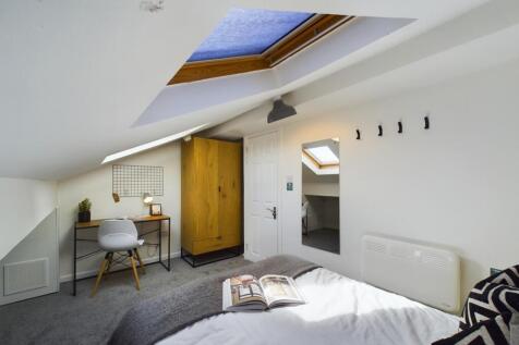A beautifully designed double bedroom featuring...