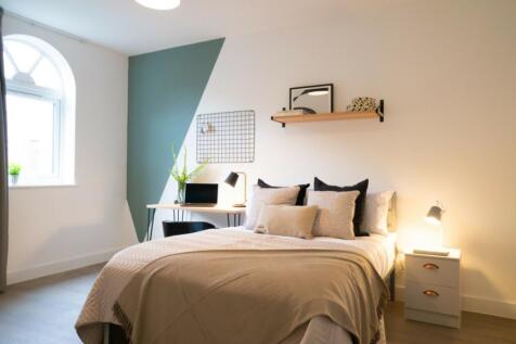 A beautifully designed double bedroom featuring...