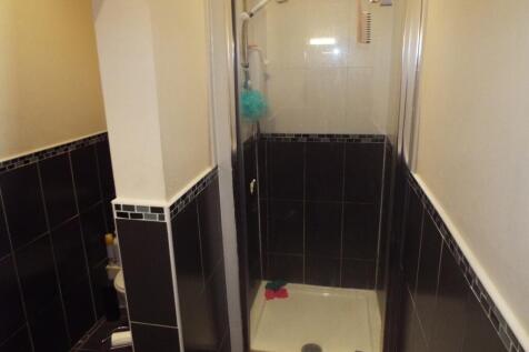 Bright and modern bathroom featuring a spacious...