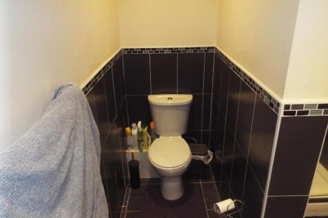 A well-maintained single toilet area featuring ...