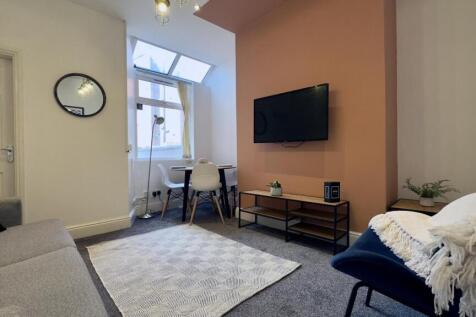 A stylish and inviting living room perfect for ...