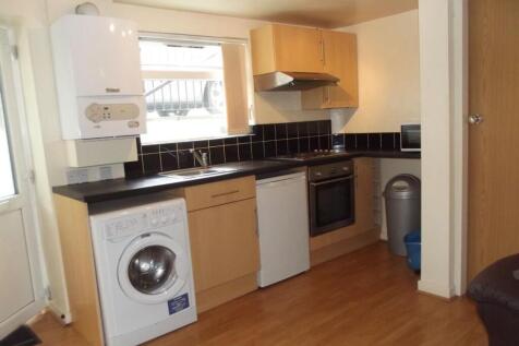 A compact and tidy kitchen featuring modern app...