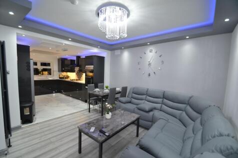 Modern open-plan living area with a large grey ...