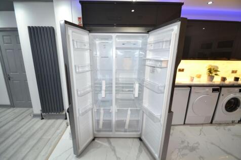 Modern kitchen with a large open stainless-stee...