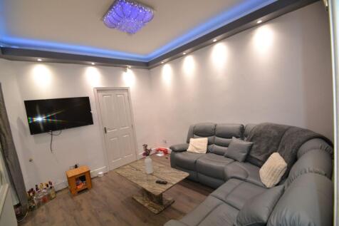 Contemporary living room with a comfortable gre...