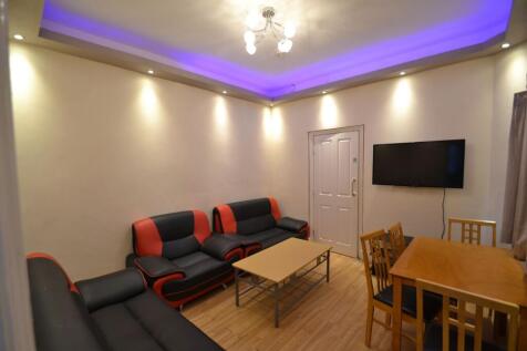 Modern living room with comfortable black and r...