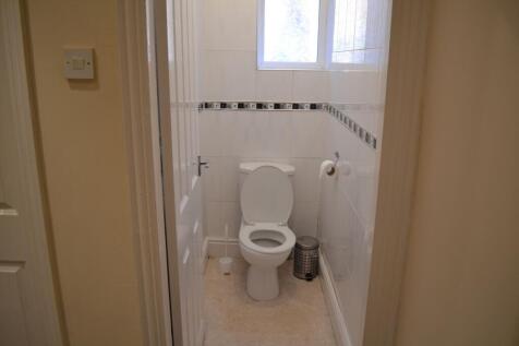 Bright and tidy bathroom with a modern toilet, ...