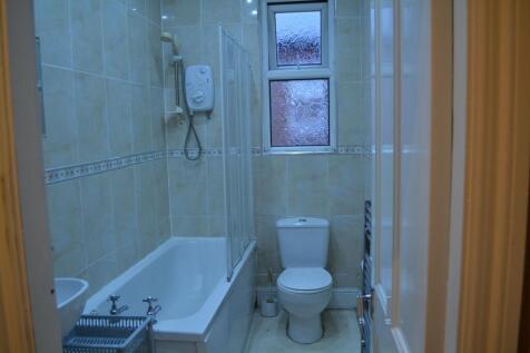 A clean and functional bathroom featuring a bat...