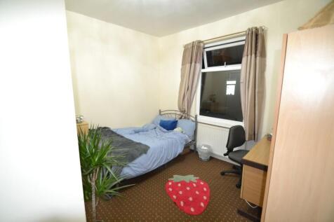 Well-presented bedroom with a double bed, desk ...