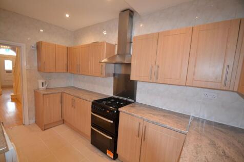 A well-maintained kitchen featuring wooden cabi...
