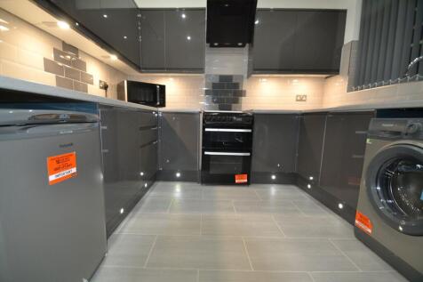 Modern, well-maintained kitchen featuring sleek...