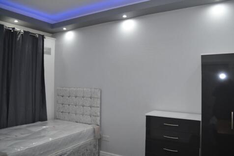 A well-lit, modern double bedroom featuring a p...