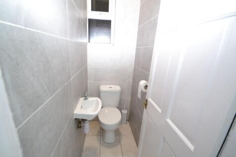 Compact bathroom with modern fixtures including...
