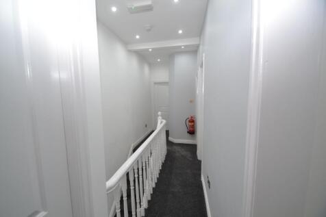 Bright, well-maintained upper hallway with fres...