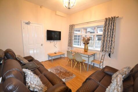 Bright and welcoming living room featuring comf...