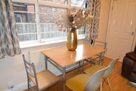 Bright and welcoming living room with large win...