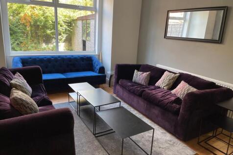 A stylish and inviting living room featuring co...