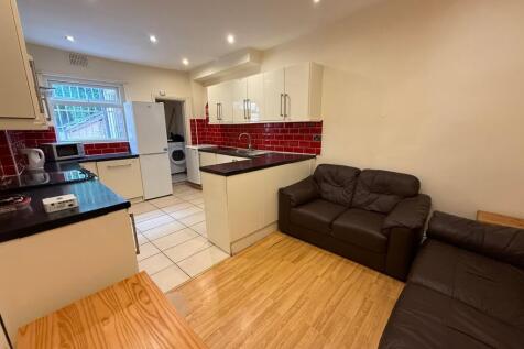 Bright open-plan communal lounge and kitchen wi...