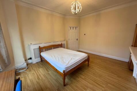 Bright, well-presented bedroom with wooden floo...