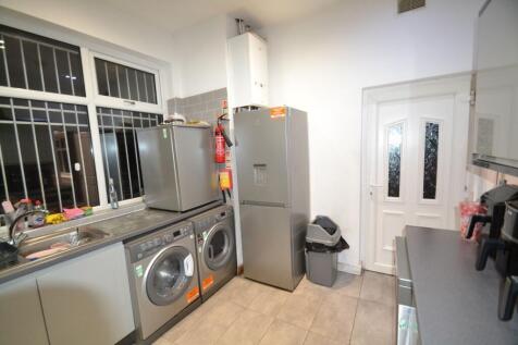 Modern compact kitchen with integrated applianc...