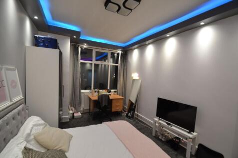 Contemporary double bedroom with a cosy upholst...