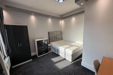 Bright, modern bedroom with a comfortable doubl...