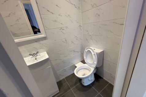 Bright, recently tiled WC with a modern toilet,...