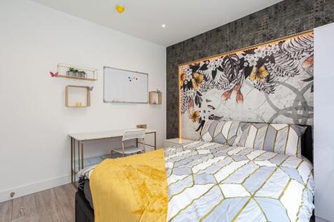 A stylish and inviting double bedroom featuring...