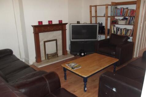 Cozy living room with leather sofas arranged ar...