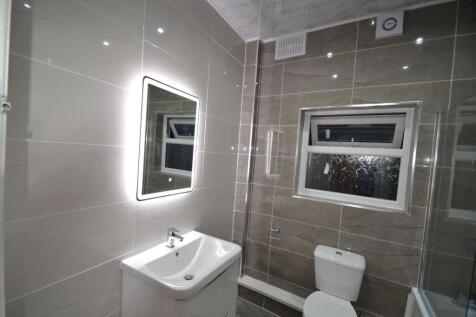 Modern, well-maintained bathroom featuring neut...