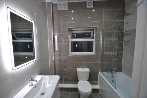 Modern bathroom featuring a sleek sink, a large...