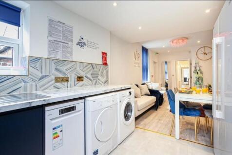 Bright, modern open-plan kitchen and lounge wit...