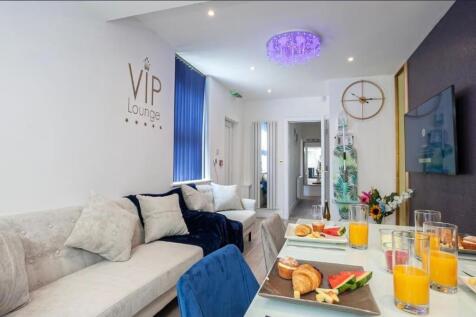 Bright, stylish communal lounge with comfortabl...