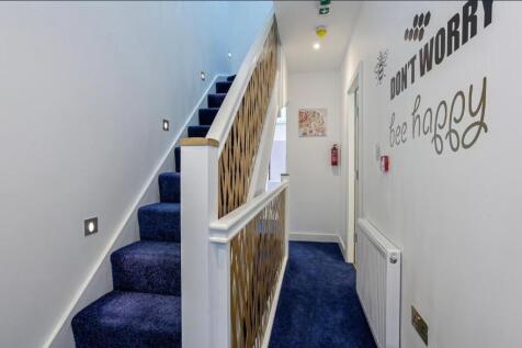 Bright, modern staircase and hallway with deep ...