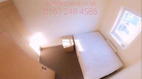 Bright, simply furnished single bedroom with a ...