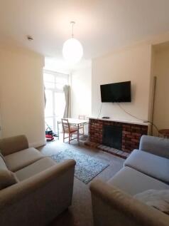 Bright, comfortable living room with two sofas ...