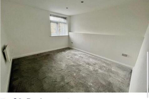 Bright, freshly painted bedroom with new carpet...