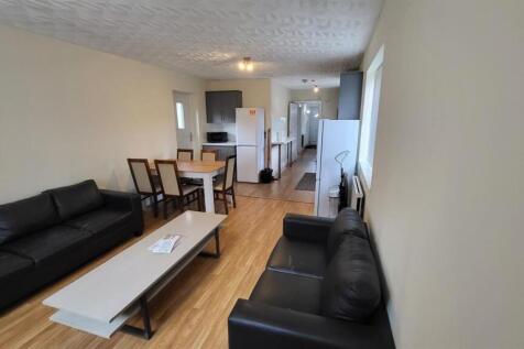 Bright, modern living room with comfortable bla...