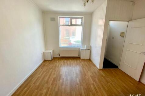 Bright, freshly painted living room with warm w...