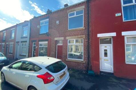 Terraced red-brick street-front with traditiona...