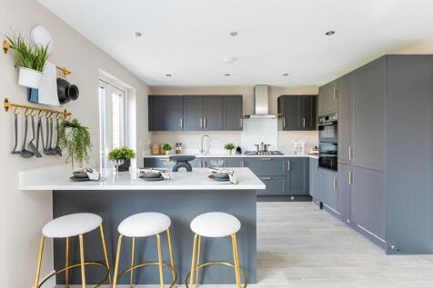 A modern kitchen with breakfast bar