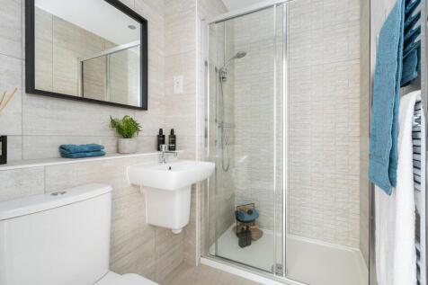 The main bedroom boasts an en-suite shower room