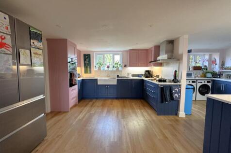 Kitchen through to the utility area.jpeg