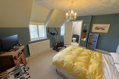 Bedroom Two leading through to the en-suite cloakr