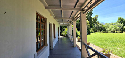 Lounge with door open onto undercover patio