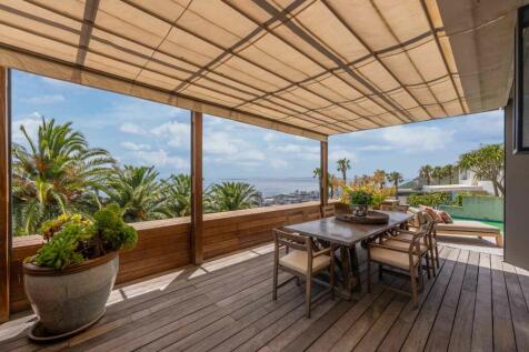 The pergola's roof opens and closes to allow as much light or shade you prefer.