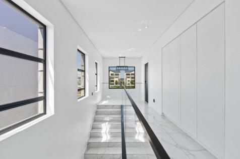 Upstairs level with built in cupboards for additional storage