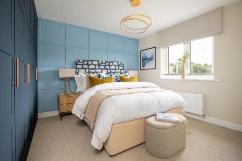 King size bedroom with ample space for furniture and en suite shower room